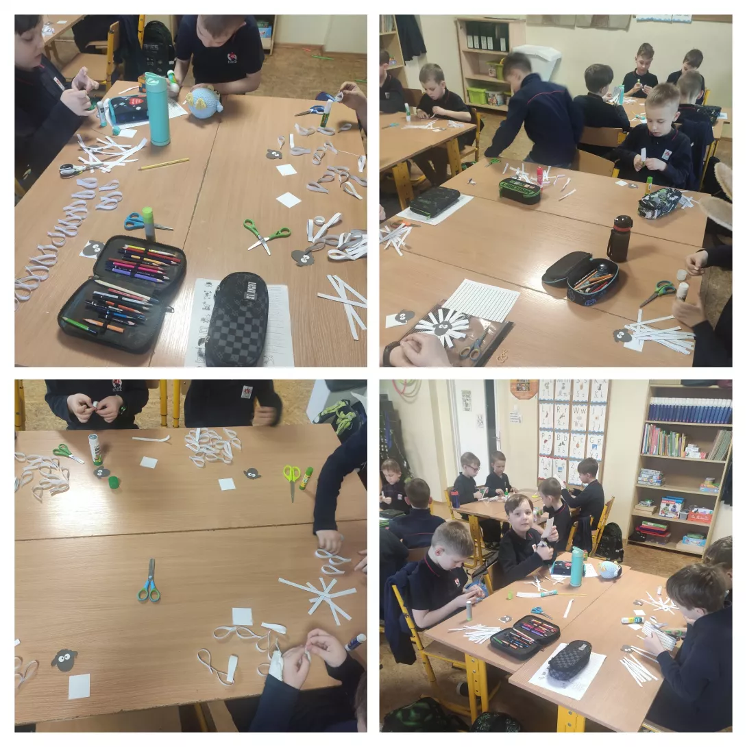 uczniowie 1b przygotowujący świąteczną dekorację klasy